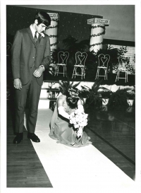 Julie Otto bowing on her way to the stage, with Ken Slavens